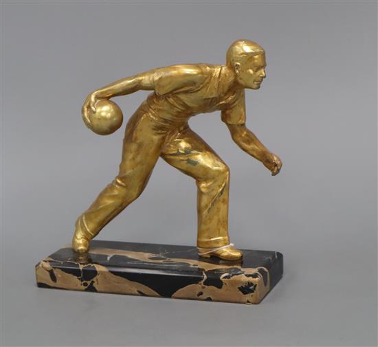 An Art Deco gilt metal figure of a bowls player, on marble base height 18cm